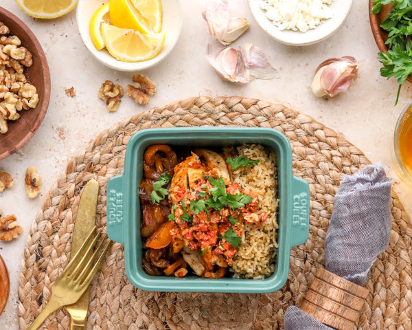 Pilaf, chicken, peppers & onion & sauce all in Souper Cubes 5 inch baking dish with walnuts, lemons, herbs, garlic on the side in bowls