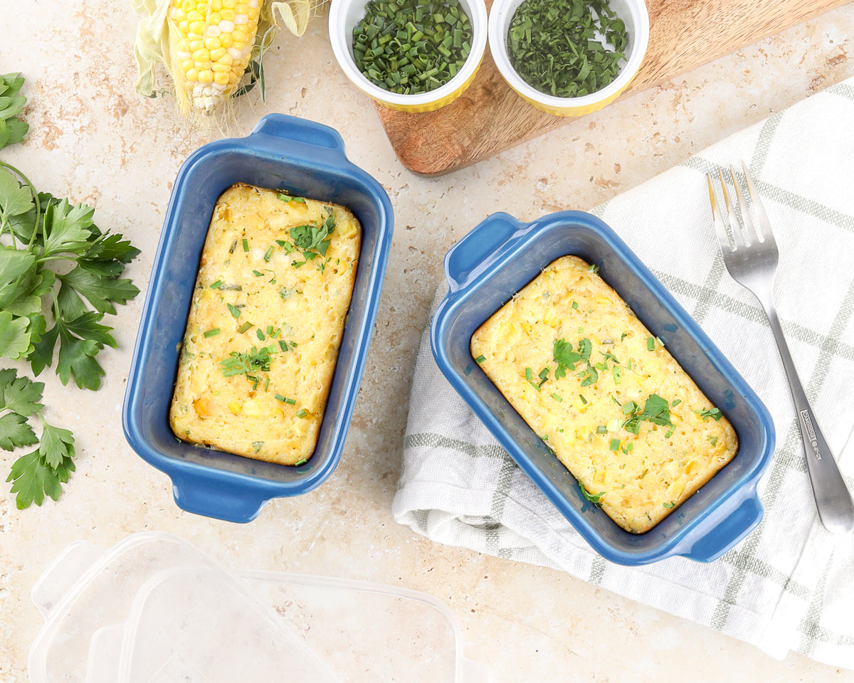 Jiffy Corn Casserole (Fresh Summer Corn, Make-Ahead Friendly) in Souper Cubes Blueberry Ceramic Baking Dishes with fresh corn.