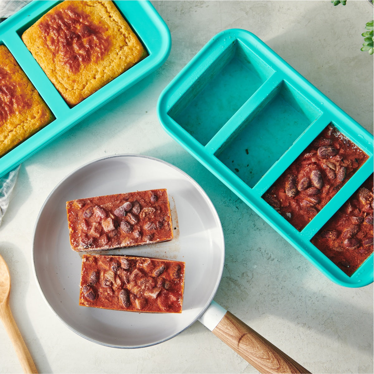 Silicone freezer trays with baked goods on a plate and countertop