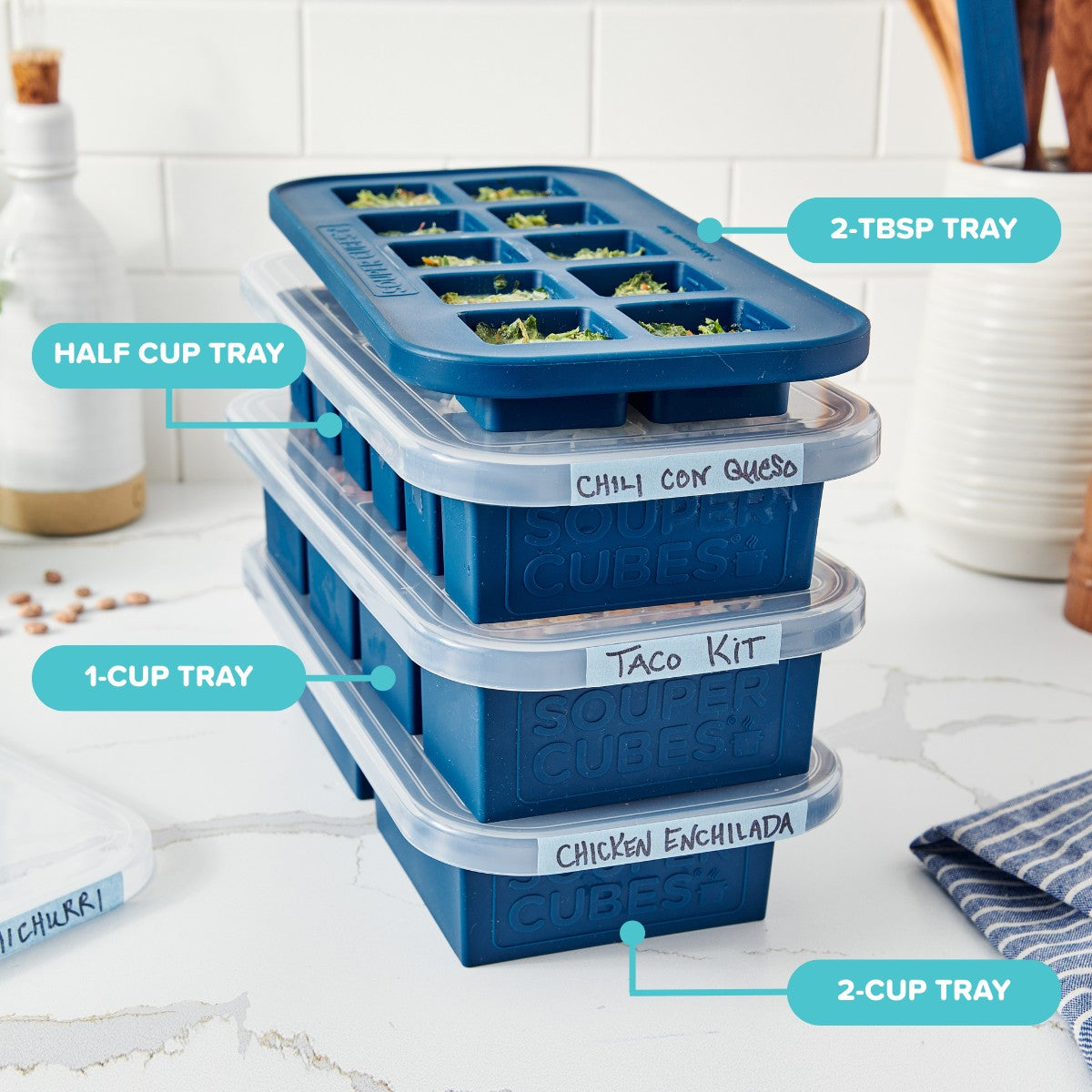 Blueberry Souper Cubes silicone food freezer trays on a kitchen counter.