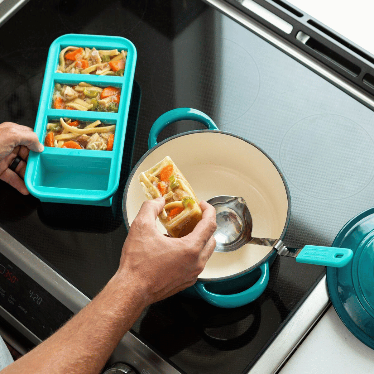 Souper Cubes being used to reheat chicken soup