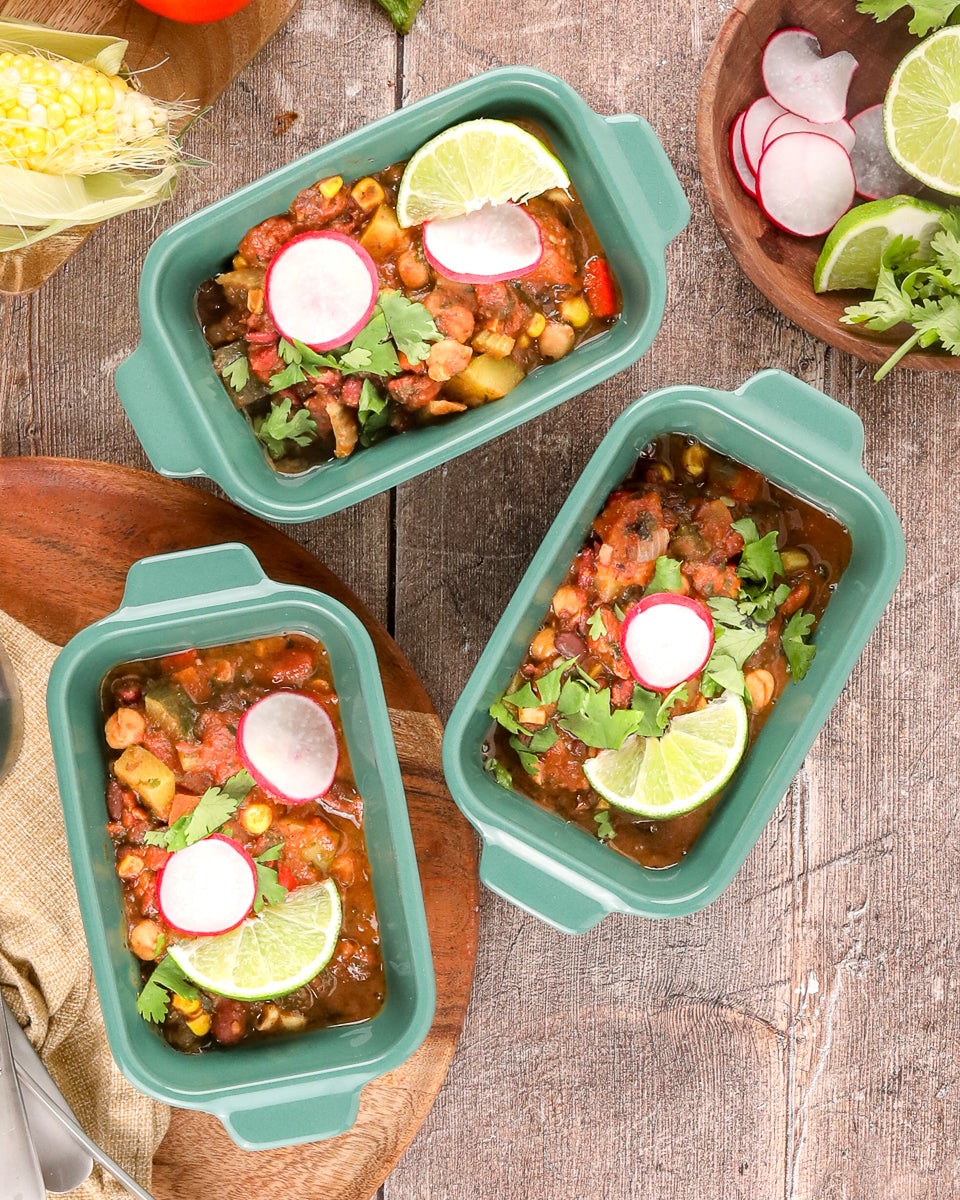 easy three-bean vegetable chili topped with cilantro and lime