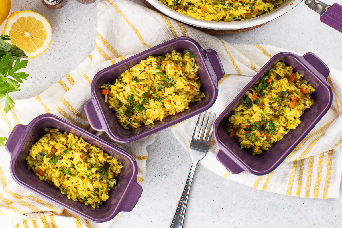 easy vegetable rice pilaf with turmeric, carrots, and zucchini in Souper Cubes baking dishes