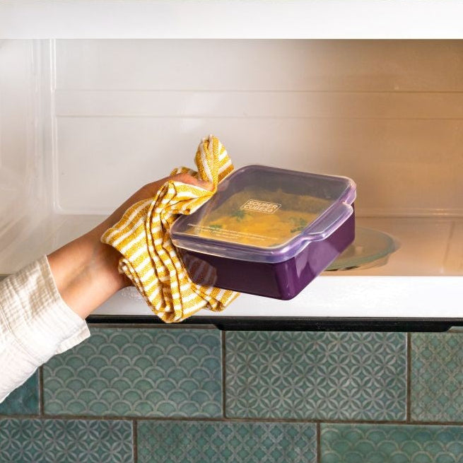 Heating broccoli cheddar soup in a Souper Cubes baking dish